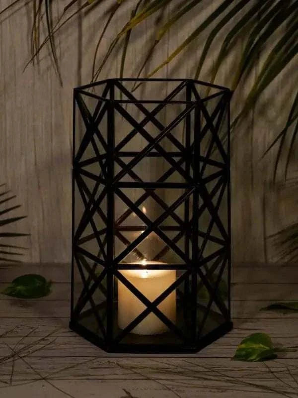 Modern geometric candle holder stand with tealight candle on wooden surface
