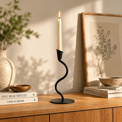 Black Tealight Single Candle Holder – ILLUMEA minimalist handcrafted metal candle stand with an elegant curved S-shaped stem and round base for modern home décor