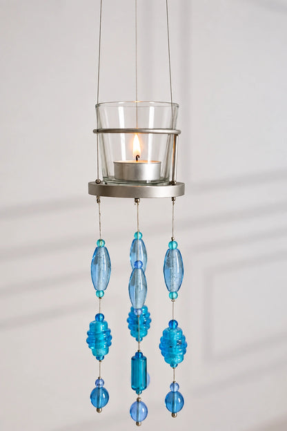 Blue Glass Beaded Hanging Votive – ILLUMEA elegant suspended tealight holder with transparent glass candle cup and multiple strands of handcrafted blue, aqua and turquoise glass beads