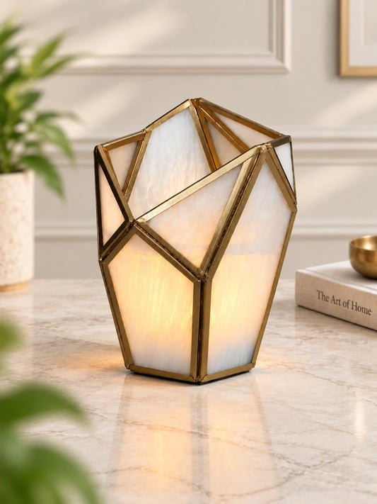 Geometric Tealight Candle Holder – ILLUMEA luxury decorative lantern featuring frosted white glass panels and an intricate brass geometric frame for elegant home décor