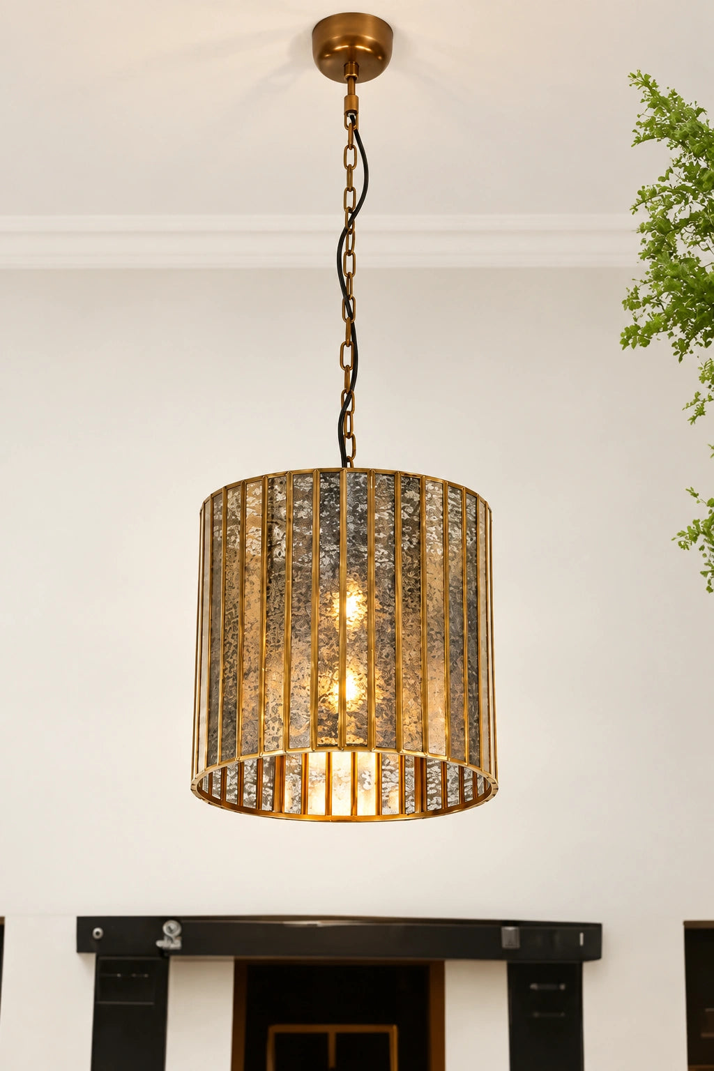 ILLUMEA Linear Shade Antique Pendant Light with an elegant antique brass frame and textured glass shade for luxury interiors
