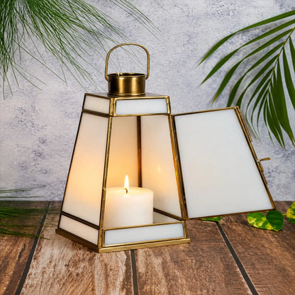 ILLUMEA white glass candle lantern featuring an antique brass frame, sturdy base and arched handle for elegant decorative lighting