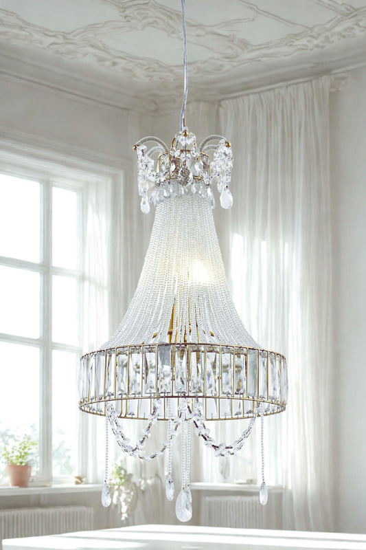 A luxurious crystal glass chandelier with a fluted glass body and hanging crystal beads, displayed in a bright room setting.