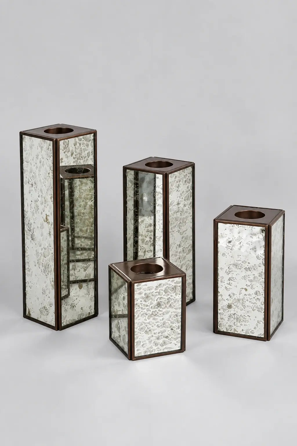 Luxury Square Mercury Glass Candle Holder Set of 4 – ILLUMEA handcrafted candle stands featuring antique silver glass panels, geometric square silhouettes and elegant metallic framing