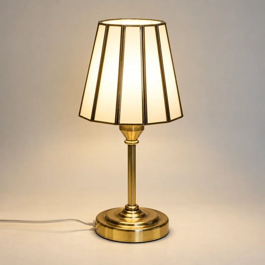 White and Gold Painted Glass Table Lamp with elegant gold metal framing and a soft illuminated shade for luxury home décor – ILLUMEA