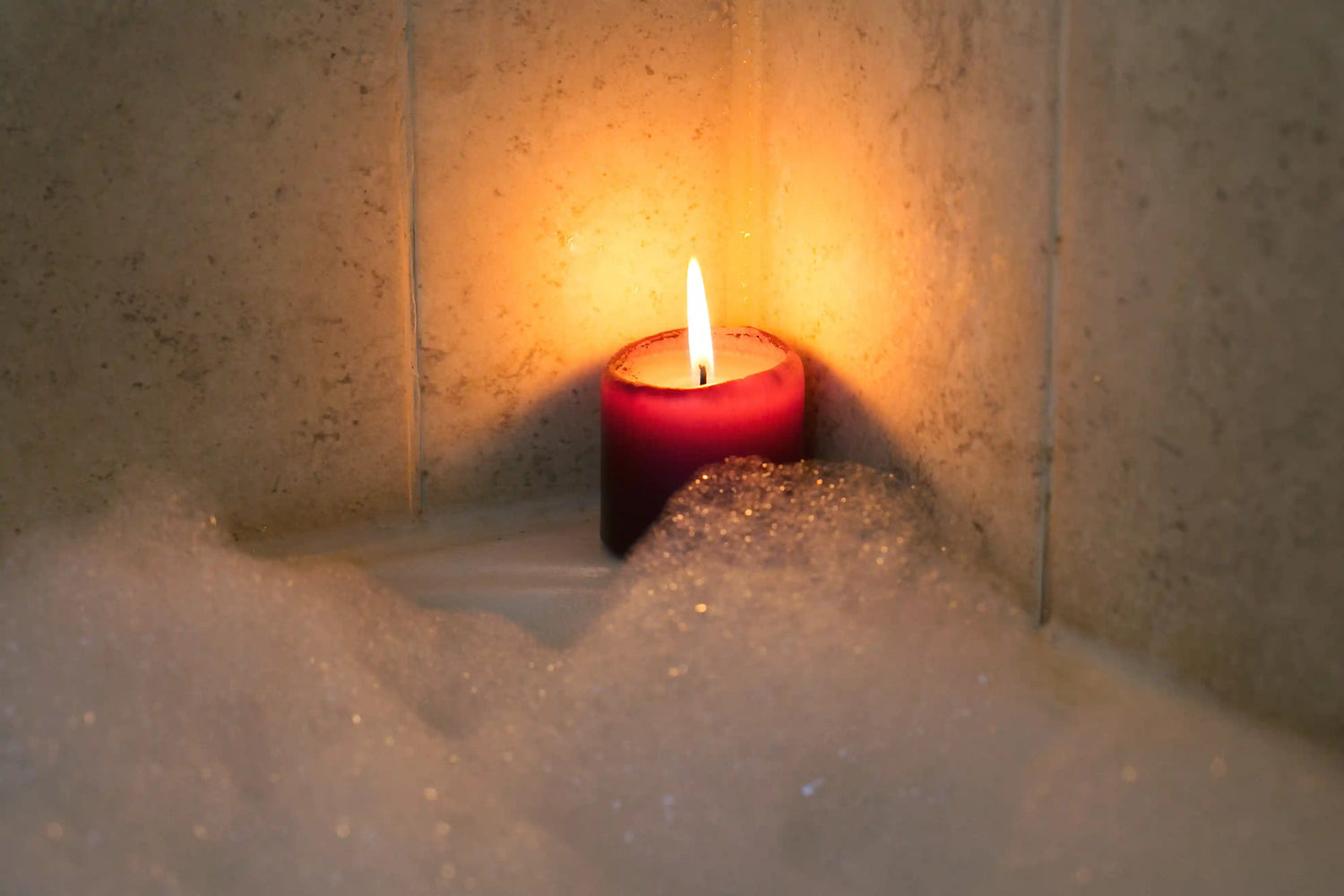 candle-burning-by-bubble-bath